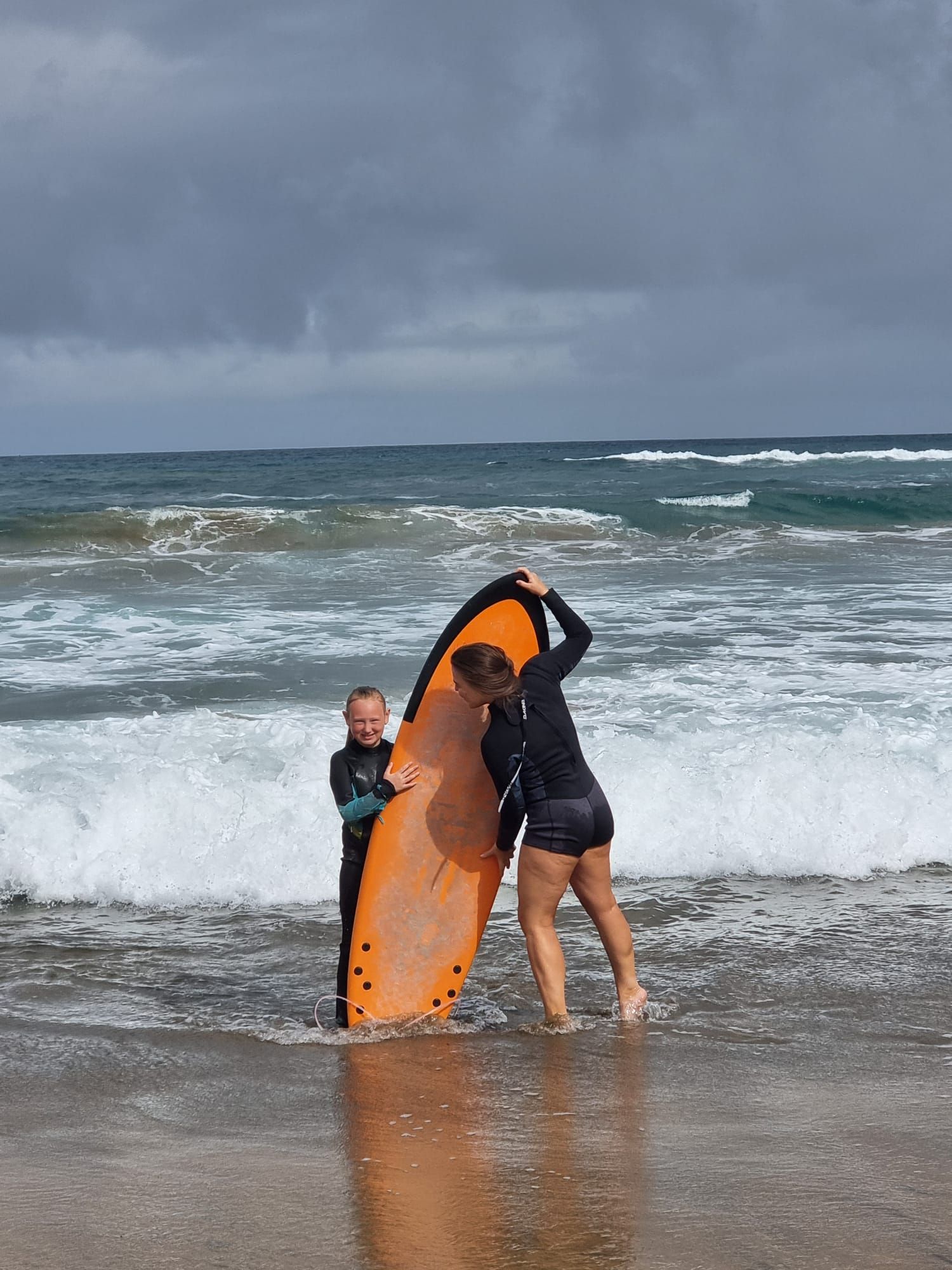 Surfer catching wave